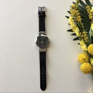Anne Klein watch with black leather band.